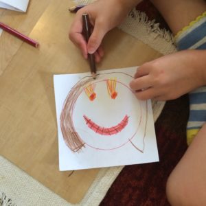 Like the planets above, the circle inset was used by this 4-year old's self-portrait.